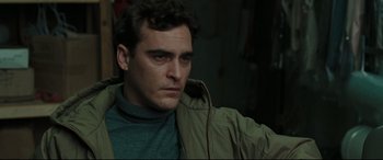 Movie still from “Two Lovers” (2008), directed by James Gray – A person wearing a jacket; Close Up shot, Over the shoulder angle