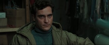 Movie still from “Two Lovers” (2008), directed by James Gray – A person wearing a jacket; Close Up shot, Over the shoulder angle