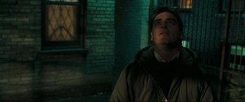 Movie still from “Two Lovers” (2008), directed by James Gray – A man standing in the dark looking up at the sky; Close Up shot, Low angle