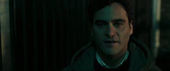 Movie still from “Two Lovers” (2008), directed by James Gray – A person wearing a suit and tie; Close Up shot, Over the shoulder angle