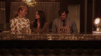 Movie still from “Deborah” (2022), directed by Noga Pnueli – A group of people sitting at a table; Medium shot, Low angle