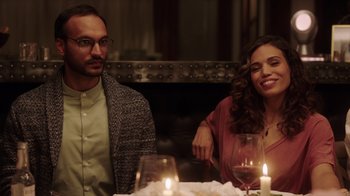 Movie still from “Deborah” (2022), directed by Noga Pnueli – A man and a woman sitting in front of a candle lit dinner table; Medium shot, Over the shoulder angle