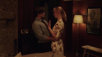Movie still from “Deborah” (2022), directed by Noga Pnueli – A man and a woman standing next to each other in a room; Medium shot, Over the shoulder angle