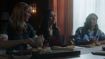 Movie still from “Deborah” (2022), directed by Noga Pnueli – A group of people sitting at a table with food; Medium shot, Over the shoulder angle