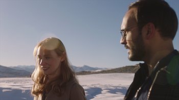 Movie still from “Deborah” (2022), directed by Noga Pnueli – A man and a woman standing next to each other in the snow; Close Up shot, Over the shoulder angle
