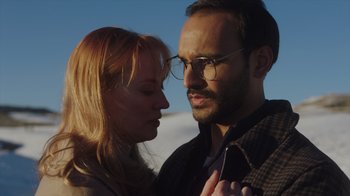 Movie still from “Deborah” (2022), directed by Noga Pnueli – A man and a woman standing next to each other; Close Up shot, Low angle