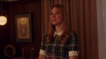 Movie still from “Deborah” (2022), directed by Noga Pnueli – A woman with long blonde hair wearing a black and white dress; Medium shot, Over the shoulder angle