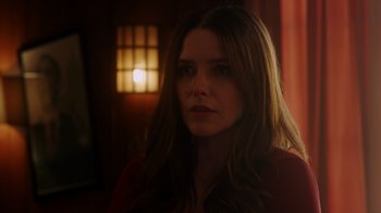 Movie still from “Deborah” (2022), directed by Noga Pnueli – A woman with long brown hair stares into the camera; Close Up shot, Over the shoulder angle