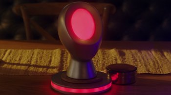 Movie still from “Deborah” (2022), directed by Noga Pnueli – A red lamp on a wooden table; Extreme Close Up shot, High angle