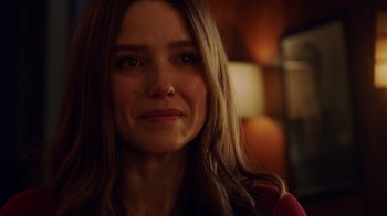 Movie still from “Deborah” (2022), directed by Noga Pnueli – A person with long brown hair; Close Up shot, Over the shoulder angle