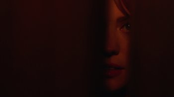 Movie still from “Deborah” (2022), directed by Noga Pnueli – A woman's face in the dark; Extreme Close Up shot, Over the shoulder angle