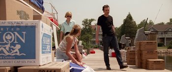 Movie still from “Deep Impact” (1998), directed by Mimi Leder – A man and a woman standing next to a woman; Wide shot, Over the shoulder angle