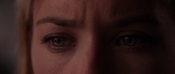 Movie still from “Deep Impact” (1998), directed by Mimi Leder – A woman's eyes with a dark background; Extreme Close Up shot, Overhead angle