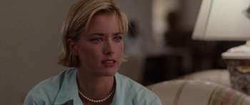 Movie still from “Deep Impact” (1998), directed by Mimi Leder – A person wearing a necklace; Close Up shot, Over the shoulder angle