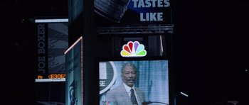 Movie still from “Deep Impact” (1998), directed by Mimi Leder – A television screen with a picture of morgan freeman on it; Close Up shot, Low angle