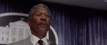 Movie still from “Deep Impact” (1998), directed by Mimi Leder – An older black man in a suit and tie; Close Up shot, Low angle