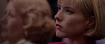 Movie still from “Deep Impact” (1998), directed by Mimi Leder – A woman's face looking to her left; Close Up shot, Over the shoulder angle