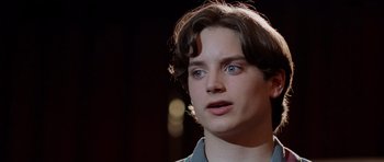 Movie still from “Deep Impact” (1998), directed by Mimi Leder – A young man with blue eyes stares into the distance; Close Up shot, Low angle