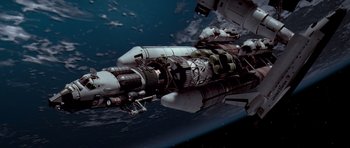 Movie still from “Deep Impact” (1998), directed by Mimi Leder – An image of a space ship in the sky; Extreme Wide shot, Overhead angle