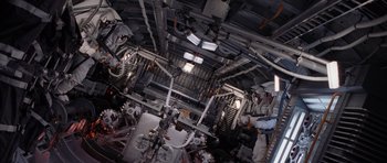 Movie still from “Deep Impact” (1998), directed by Mimi Leder – An overhead view of a room with a lot of lights; Wide shot, Overhead angle