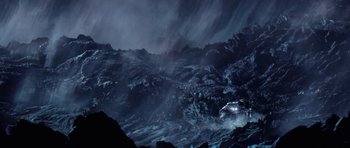 Movie still from “Deep Impact” (1998), directed by Mimi Leder – A helicopter flying over a mountain in the dark; Extreme Wide shot, High angle
