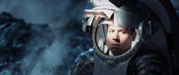 Movie still from “Deep Impact” (1998), directed by Mimi Leder – A man in a space suit looking into a mirror; Close Up shot, Overhead angle