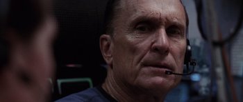 Movie still from “Deep Impact” (1998), directed by Mimi Leder – An older man with a cigarette in his mouth; Close Up shot, Low angle