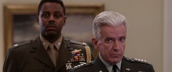 Movie still from “Deep Impact” (1998), directed by Mimi Leder – Two men in military uniforms are looking at the camera; Close Up shot, Over the shoulder angle