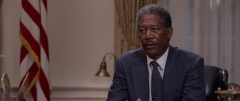 Movie still from “Deep Impact” (1998), directed by Mimi Leder – An older black man in a suit and tie; Close Up shot, Over the shoulder angle