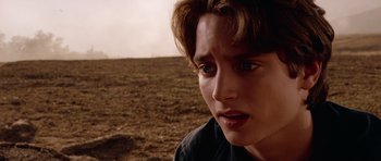 Movie still from “Deep Impact” (1998), directed by Mimi Leder – A person looking at the camera; Close Up shot, Over the shoulder angle