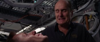 Movie still from “Deep Impact” (1998), directed by Mimi Leder – An older man is crying while holding something in his hand; Close Up shot, Overhead angle