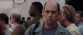 Movie still from “Deep Impact” (1998), directed by Mimi Leder – A person with his head down; Close Up shot, Over the shoulder angle