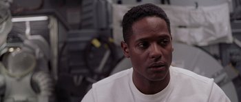 Movie still from “Deep Impact” (1998), directed by Mimi Leder – A person wearing a white t - shirt; Close Up shot, Over the shoulder angle