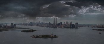 Movie still from “Deep Impact” (1998), directed by Mimi Leder – The statue of liberty in the middle of a large body of water; Extreme Wide shot, Low angle
