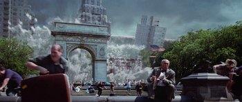Movie still from “Deep Impact” (1998), directed by Mimi Leder – A man sitting on a bench in front of an arch; Extreme Wide shot, Over the shoulder angle