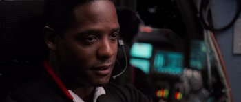 Movie still from “Deep Impact” (1998), directed by Mimi Leder – A person wearing a headset; Close Up shot, Low angle