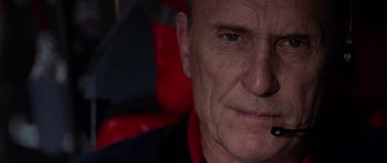 Movie still from “Deep Impact” (1998), directed by Mimi Leder – A person wearing a red shirt; Close Up shot, Low angle