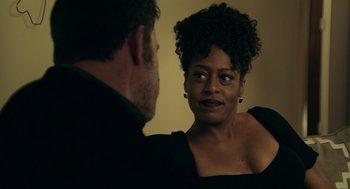 Movie still from “Deep Water” (2022), directed by Adrian Lyne – A man and a woman are talking to each other; Close Up shot, Over the shoulder angle