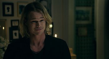 Movie still from “Deep Water” (2022), directed by Adrian Lyne – A person with long blonde hair; Close Up shot, Over the shoulder angle