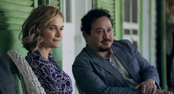 Movie still from “Deep Water” (2022), directed by Adrian Lyne – A man and a woman sitting next to each other; Medium shot, Over the shoulder angle