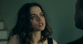 Movie still from “Deep Water” (2022), directed by Adrian Lyne – A person with long brown hair; Close Up shot, Low angle