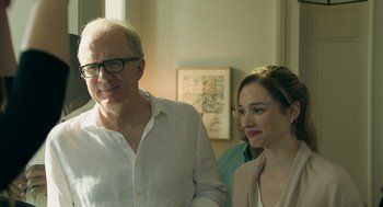 Movie still from “Deep Water” (2022), directed by Adrian Lyne – A man and a woman standing next to each other in a room; Close Up shot, Over the shoulder angle