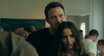 Movie still from “Deep Water” (2022), directed by Adrian Lyne – A man and a woman pose for a picture; Close Up shot, Over the shoulder angle