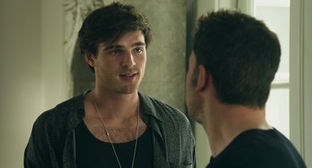 Movie still from “Deep Water” (2022), directed by Adrian Lyne – A man looking at himself in the mirror; Close Up shot, Over the shoulder angle