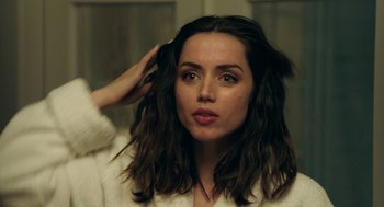 Movie still from “Deep Water” (2022), directed by Adrian Lyne – A person holding her hair; Close Up shot, Over the shoulder angle