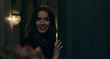 Movie still from “Deep Water” (2022), directed by Adrian Lyne – A beautiful woman standing next to a door; Close Up shot, Over the shoulder angle