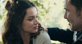 Movie still from “Deep Water” (2022), directed by Adrian Lyne – A person sitting on a chair; Close Up shot, Over the shoulder angle