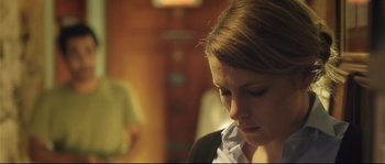 Movie still from “Upstream Color” (2013), directed by Shane Carruth – A woman sitting in front of a computer screen; Close Up shot, Low angle