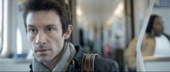 Movie still from “Upstream Color” (2013), directed by Shane Carruth – A person wearing a jacket; Close Up shot, Over the shoulder angle