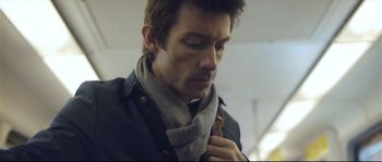 Movie still from “Upstream Color” (2013), directed by Shane Carruth – A person wearing a scarf; Close Up shot, Low angle
